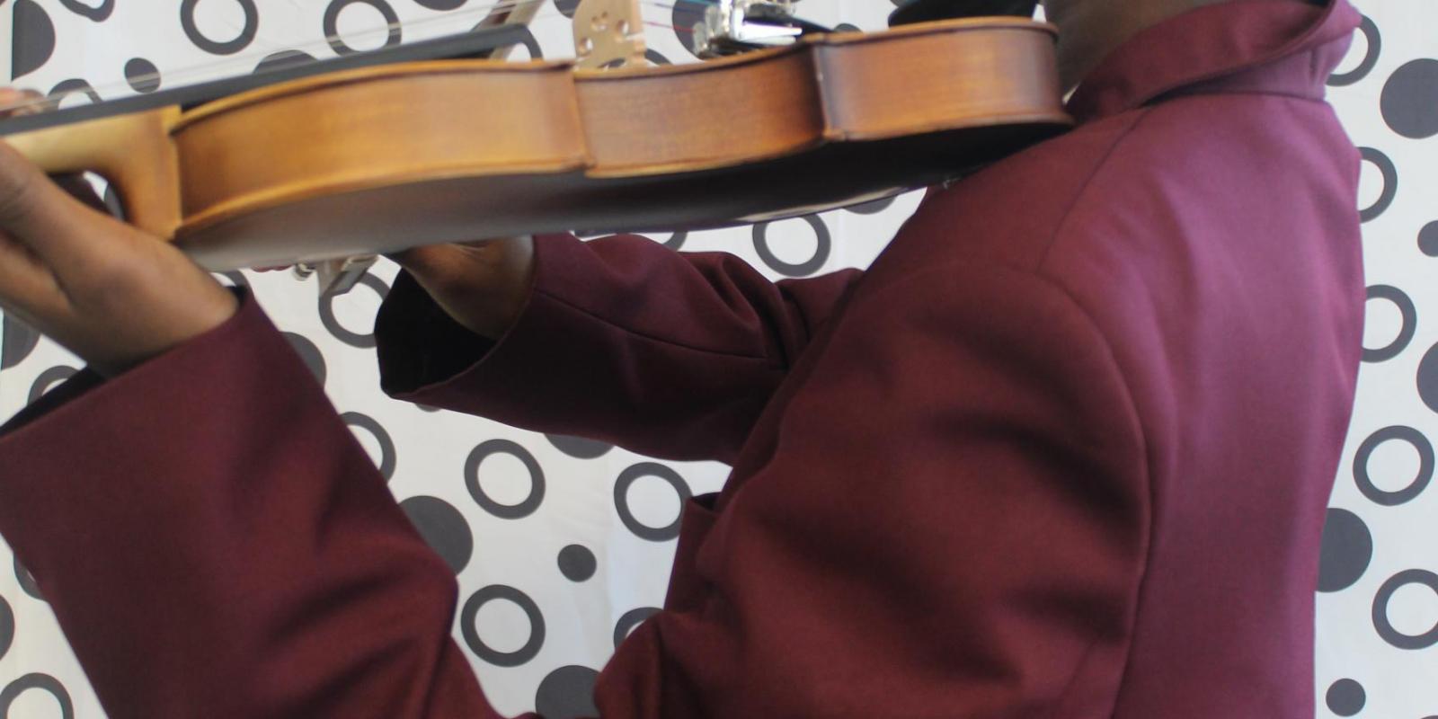 school boy playing violin