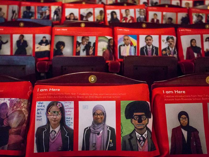 Photos of young people placed on the seats of the London Coliseum