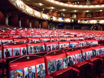 seat covers of school children on seats at london coliseum