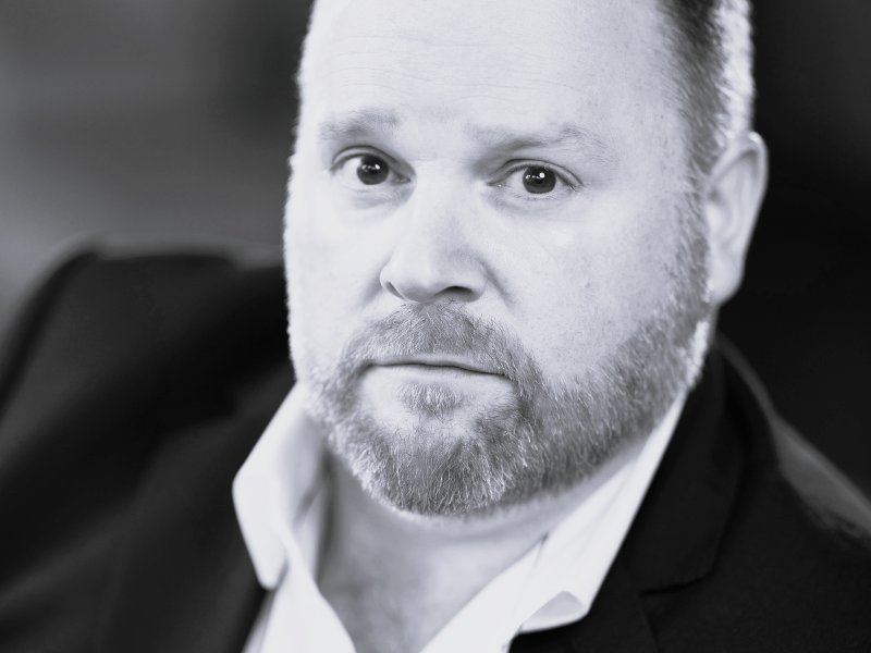 Black and white headshot of Roland Wood