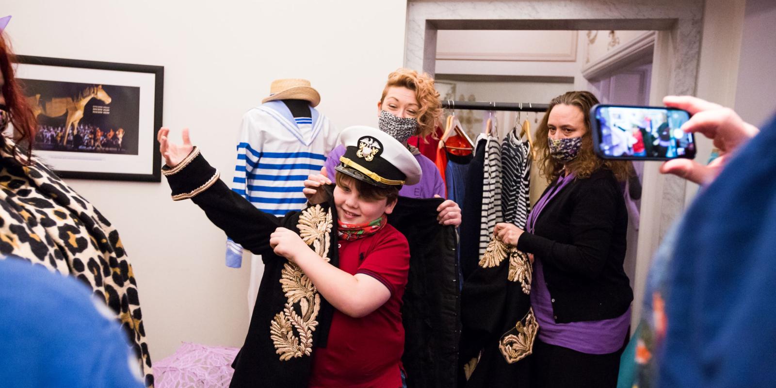 Trying on costumes at our Relaxed Performance of HMS Pinafore