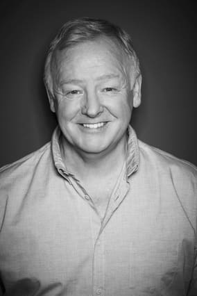 Black and white portrait of Les Dennis