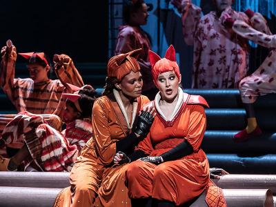 Two women dressed as foxes on stage