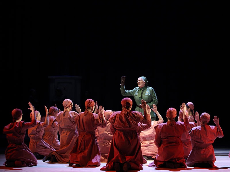 The Handmaid's Tale: Women in red on stage