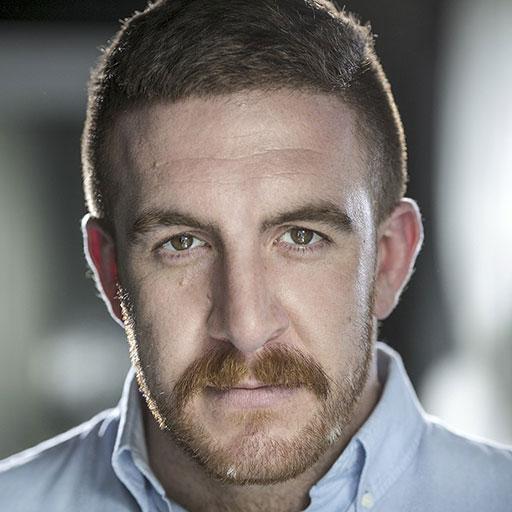 Adam Vaughan looking directly to camera