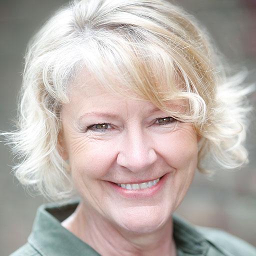 Close up portrait of Annie Wensak smiling to camera