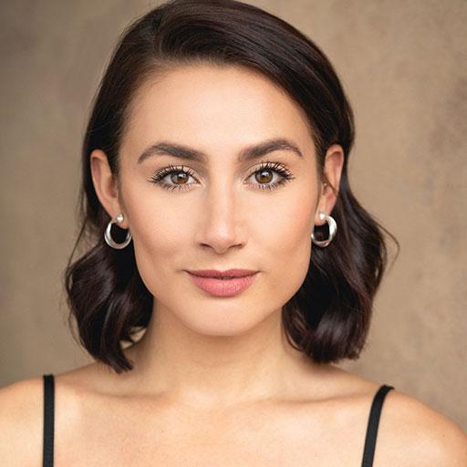 Head and shoulders portrait of Rebekah Lowings looking directly to camera