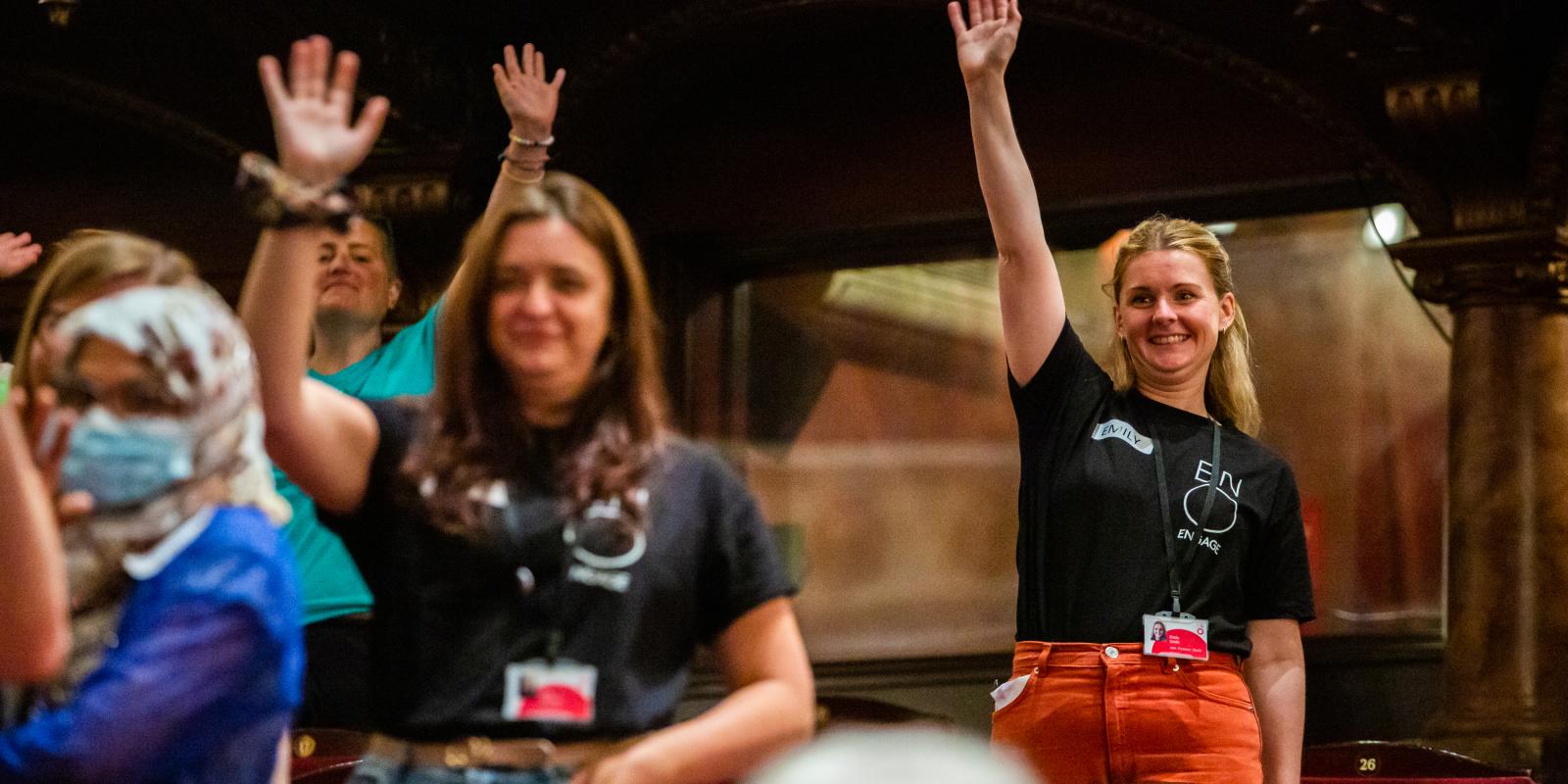 ENO Engage team with arms in the air at London Coliseum