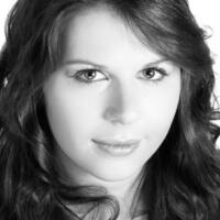 Black and white of headshot of Carrie-Ann Williams looking to camera
