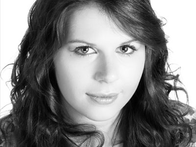 Black and white of headshot of Carrie-Ann Williams looking to camera