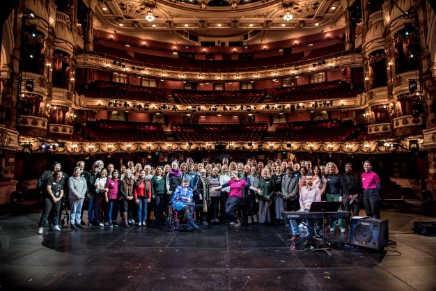 ENO Breathe participants standing together on Coliseum stage