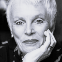 Black and white headshot of Fiona Kimm resting on her hand.