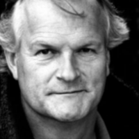 Black and white headshot of Clive Mantle facing the camera