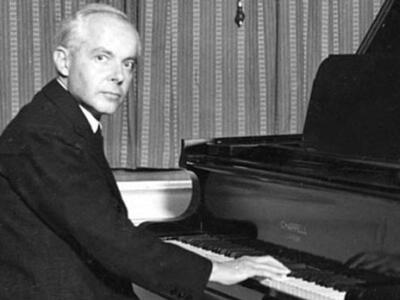 Bela Bartok sat at a piano