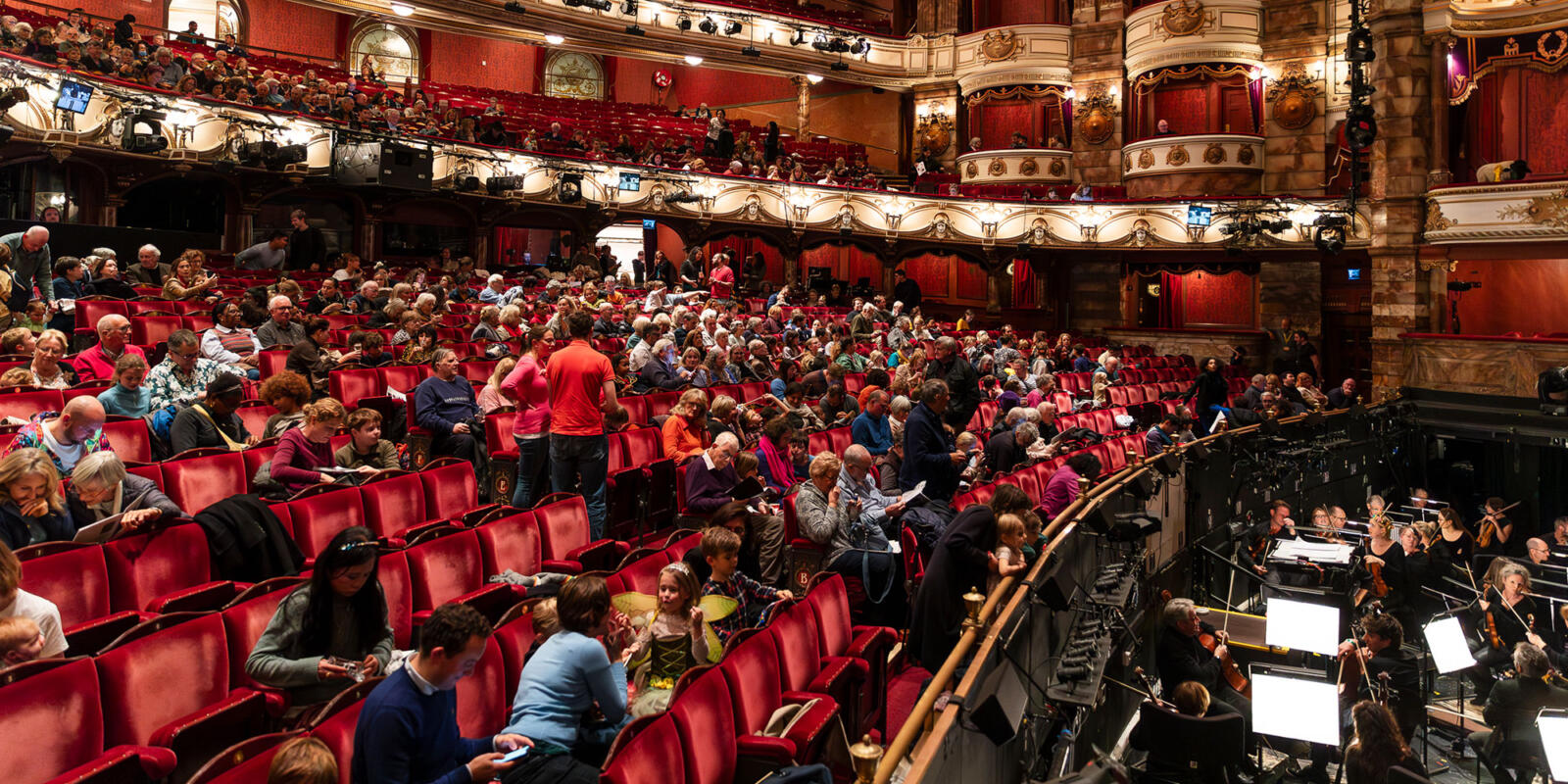 View of the audience in the auditorium of the London Coliseum prior to ENO's Relaxed Performance of Iolanthe Wednesday 25 October 2023 © Lloyd Winters