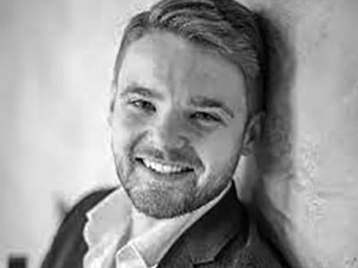 Headshot of Aaron Godfrey-Mayes